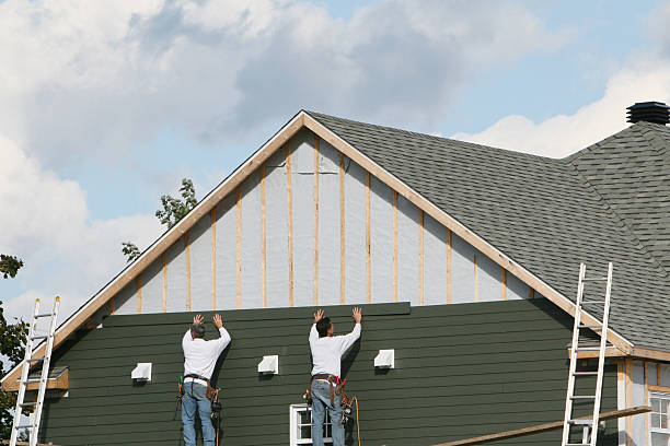 Professional Storm Damage Siding Repair technician working in Roanoke, IN